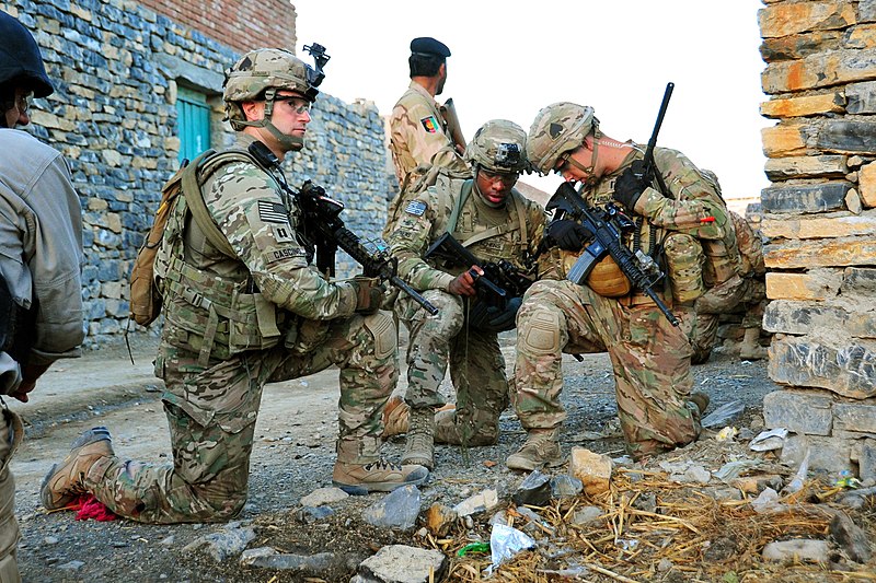 File:U.S. Army Capt. Lou Cascino, left, pulls security while Staff Sgt. Eric Stephens, center, and 1st Lt. James Kromhout verify their position during a partnered patrol in the village of Madi Khel in the Khowst Pro 131020-A-QG286-010.jpg