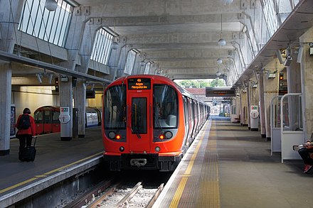 A Metropolitan line train at Uxbridge, with a Piccadilly line train to the left. This section is shared between the two lines.