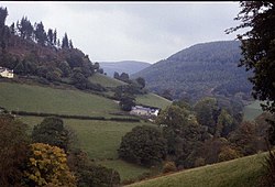 The lower part of the Eglwyseg valley, near Hendre, showing its characteristic landscape of woods and steeply sloping pastures. Valley of the River Eglwyseg - geograph.org.uk - 83811.jpg