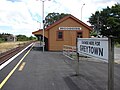 A reminder of bygone days. The original Woodside station building and a platform signboard that is reminiscent of the one that was on the original island platform, which read: "Woodside Junction. Change here for Greytown."