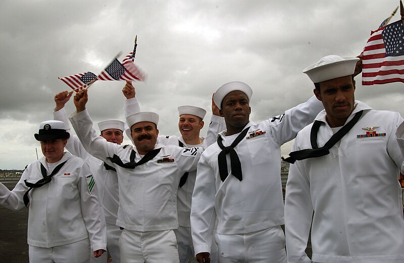 File:070620-N-MF909-190.CORONADO, Calif. (April 20, 2007) - Sailors manning the rails wave American flags to the crowd gatherd on the pier as USS Ronald Reagan (CVN 76) approaches Naval Air Station North Island. The 070620-N-MF909-190.jpg