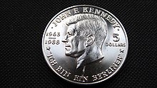 5-Dollar-Münze mit dem Porträt John F. Kennedys und dessen berühmten Ausspruch „Ich bin ein Berliner“