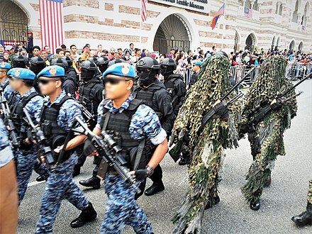 PASKAU detachments with dressed in the No.4 Digital Camouflage, tactical gear and ghillie suits parading during the 60th National Day Parade of Malaysia at Sultan Abdul Samad Street, Kuala Lumpur.