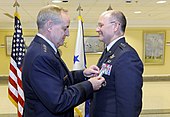 Lt Gen James "JJ" Jackson is presented with the Air Force Distinguished Service Medal by CSAF Mark Welsh at his promotion ceremony on 16 August 2012. AFRC Commander promoted 120816-F-EK235-074.jpg