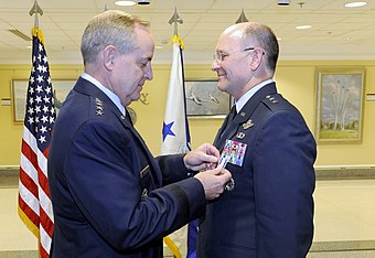 Lt Gen James "JJ" Jackson is presented with the Air Force Distinguished Service Medal by CSAF Mark Welsh at his promotion ceremony on 16 August 2012.