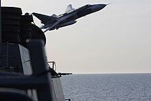 A Russian Sukhoi Su-24 attack aircraft makes a very-low-altitude pass by USS Donald Cook on 12 April 2016. A Russian Sukhoi Su-24 makes a very-low altitude pass by the USS Donald Cook (DDG 75).jpg