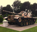 Army tank behind VFW post