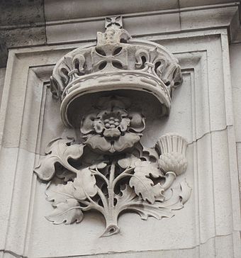 Rose, thistle and shamrock motif on gate pillar at Buckingham Palace