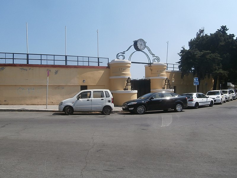 File:Clock above the Gate of Stadion Diagoras in Rhodes 5 September 2019.jpg