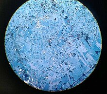 A microscopic picture of covellite Covellite and Pyrite (V).jpg