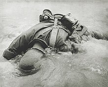 Soldier of the 322nd RCT killed assaulting Red Beach Dead soldier on red beach Angaur Island.jpg