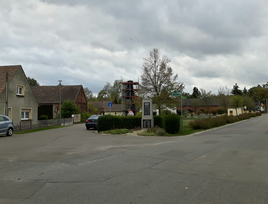 Village green with a memorial for the fallen in the center of Groß Lübbenau