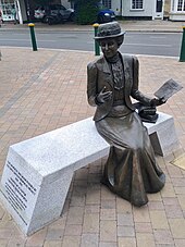 Statue of Emily Davison, in Epsom Emily Wilding Davison statue, Epsom High Street (July 2021).jpg
