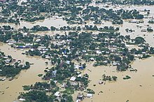 A flooded village submerged under floodwater Flooded village, Assam Floods 2022.jpg