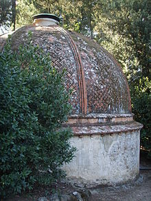 Boboli Gardens, Florence, Italy: domed icehouse (ghiacciaia) half-sunk into a shaded slope Ghiacciaie di Boboli 01.JPG