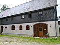 Residential stable house and angled barn of a farm