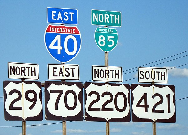 An extreme example: I-40, I-85 Business, US 29, US 70, US 220, and US 421 formerly ran concurrently in Greensboro, North Carolina. In 2008, I-40 was r