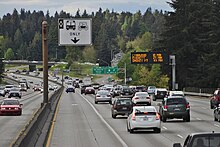 A high-occupancy vehicle lane on Interstate 5 in Seattle Interstate 5 northbound near Shoreline, WA - HOV and VMS.jpg