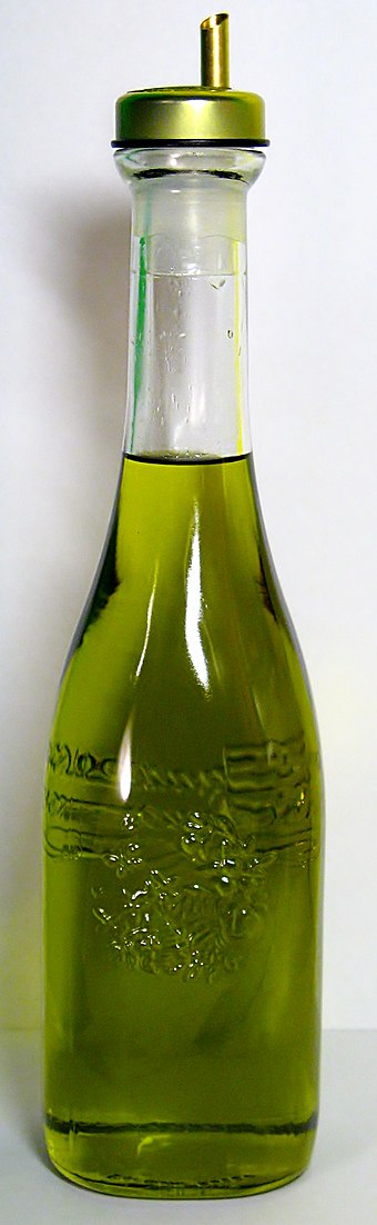 A bottle of olive oil used in food