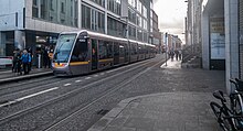 A Luas on the westbound platform bound for Saggart Jervis Luas stop Dublin.jpg