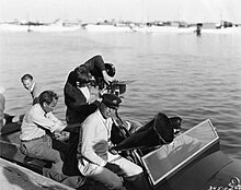Vidor and his cameramen set out in his Hacker-Craft speedboat to film water sequences for The Patsy. King Vidor on a Hacker.jpg