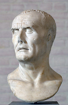 Scuplture of a man's head and a small part of his shoulders