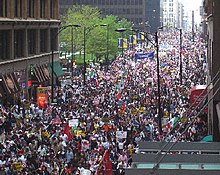 A rally on May Day 2006 in Chicago. The protests began in response to proposed legislation known as H.R. 4437, which would raise penalties for illegal immigration and classify undocumented immigrants and anyone who helped them enter or remain in the US as felons. May 1 2006 Rally in Chicago.jpg