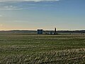 Oil battery with Moose Mountain Upland in the background