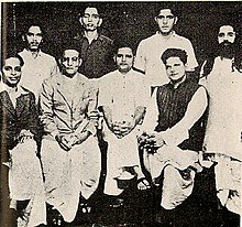 Group photo of people accused in the murder of Mahatma Gandhi. Standing (L to R): Shankar Kistaiya, Gopal Godse, Madan Lal Pahwa, Digambar Ramchandra Badge. Seated (L to R): Narayan Apte, Vinayak D. Savarkar, Nathuram Godse, Vishnu Karkare