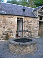 The well in the courtyard outside the Tournament cafe