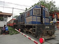 A Philippine National Railways 2500-class diesel electric locomotive hauling KiHa 52 coaches in Santa Mesa, Manila. PNR Kiha 52 (ex-JR) train (Anonas Street, Santa Mesa, Manila)(2017-07-12) 2.jpg