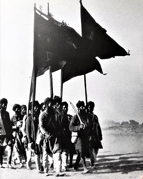 Photograph of the 2nd Shahidi Jatha procession at Jaito, showing the Nishan Sahib carriers, circa February 1924 during the Jaito Morcha