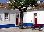 Traditionell hustyp i Porto Corvo i Portugal