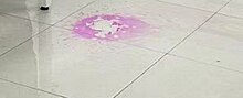 Potassium hydroxide spillage, stained red by phenolphthalein Potassium hydroxide spillage.jpg