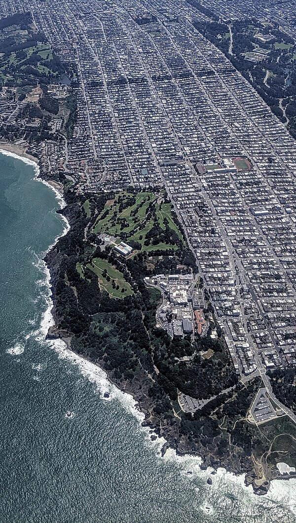 Aerial view due east of Lands End and Sea Cliff and Richmond districts, outer at lower right, inner at upper left