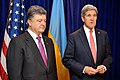 U.S. Secretary of State John Kerry and Ukrainian President-elect Petro Poroshenko shake hands after addressing reporters before a discussion that preceded Poroshenko's meeting with President Obama in Warsaw, Poland, on June 4, 2014.