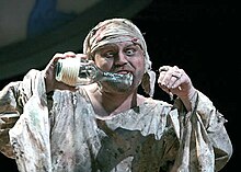 Caliban has a conversation with his imaginary friends in Folger Theatre's production of Shakespeare's The Tempest. Shakespear's Caliban.jpg