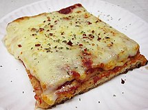 A slice of Sicilian pizza