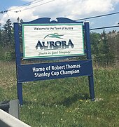 "Home of Robert Thomas" city sign in Aurora Sign of Aurora.jpg