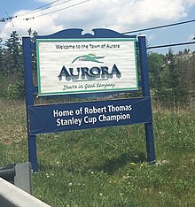 "Home of Robert Thomas" city sign in Aurora Sign of Aurora.jpg