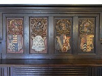 Far right: 16th century escutcheon showing the quartered arms of Sir John Chichester (quarterly of 4: Chichester, Raleigh, Beaumont quartering Willington, Wise), impaling Courtenay quartering Redvers. Chimney-piece in Simonsbath House, having been moved there in the early 20th century by the Fortescue family from their seat at Weare Giffard Hall. Hugh Fortescue (1544-1600) of Weare Giffard married Elizabeth Chichester (died 1630), a daughter of Sir John Chichester by his wife Gertrude Courtenay SimonsbathHouseHeraldicChimneypiece.jpg
