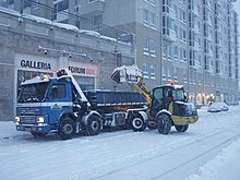 Snow in Helsinki being loaded on truck for transportation to a snow dump site Snow removal in Helsinki 212.jpg