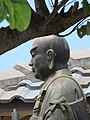 Starr-090806-4087-Bauhinia monandra-habit with Puunene Nichiren Mission Buddha sculpture-Kahului-Maui (24971901355).jpg