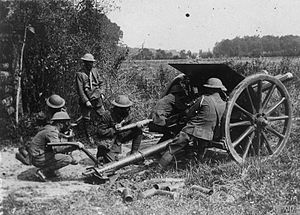 Gunners wearing Small box respirators firing an 18-pounder, August 1918. The British Army on the Western Front, 1914-1918 Q80089.jpg