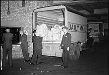 Bundles of newspapers loaded into the back of a Daily Mail van in the early hours for delivery to newsagents in 1944 The Makings of a Modern Newspaper- the Production of 'The Daily Mail' in Wartime, London, UK, 1944 D20463.jpg