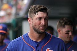 Tim Tebow in the dugout.jpg