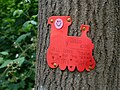 Image of a train affixed to a tree in Scadbury Park.