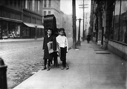 Two 7 year old newsies, profane and smart, selling Sunday