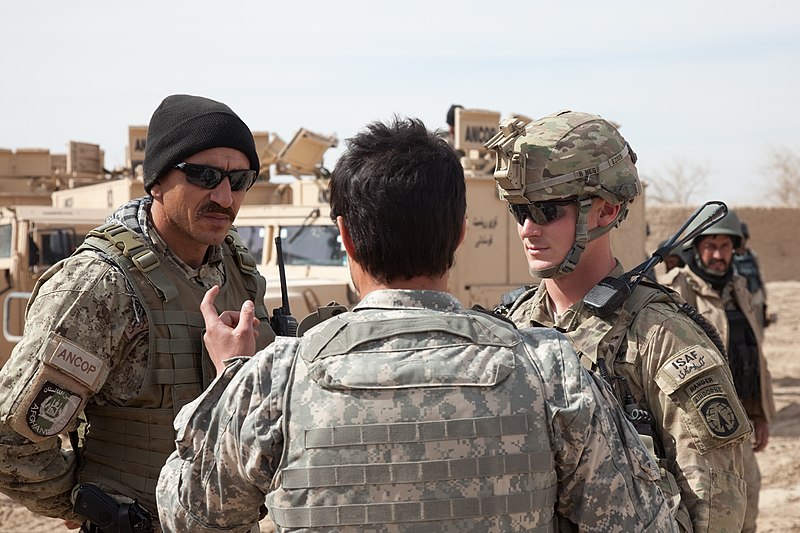 File:U.S. Army Staff Sgt. Marcus Emilio, right, communicates though an interpreter with a counterpart from the Afghan National Civil Order Police while on patrol in the Maiwand district, Kandahar province 120224-A-QD683-028.jpg