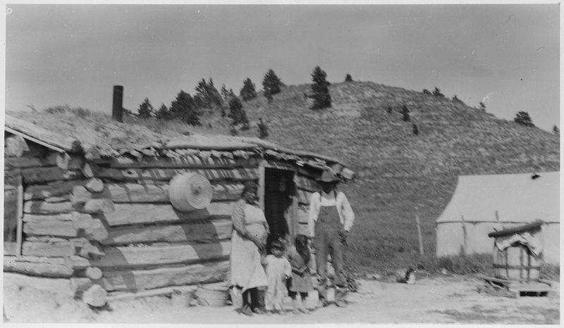 File:Willie Wounded and family in front of house - NARA - 285588.jpg